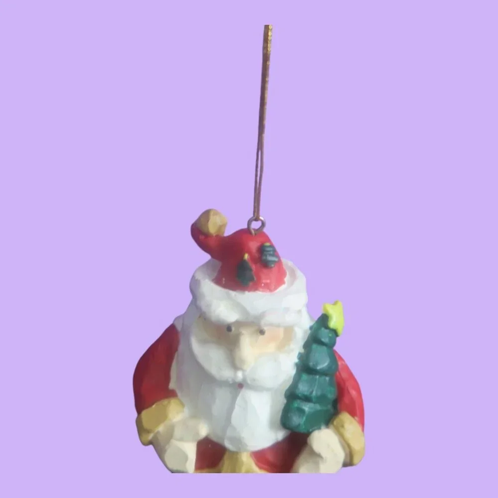 Round ball ornament bottom Santa with tree on hat and in hand in red and white
